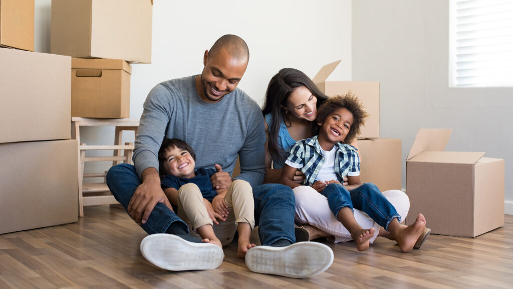 A family moving into a Quality LDG Apartment